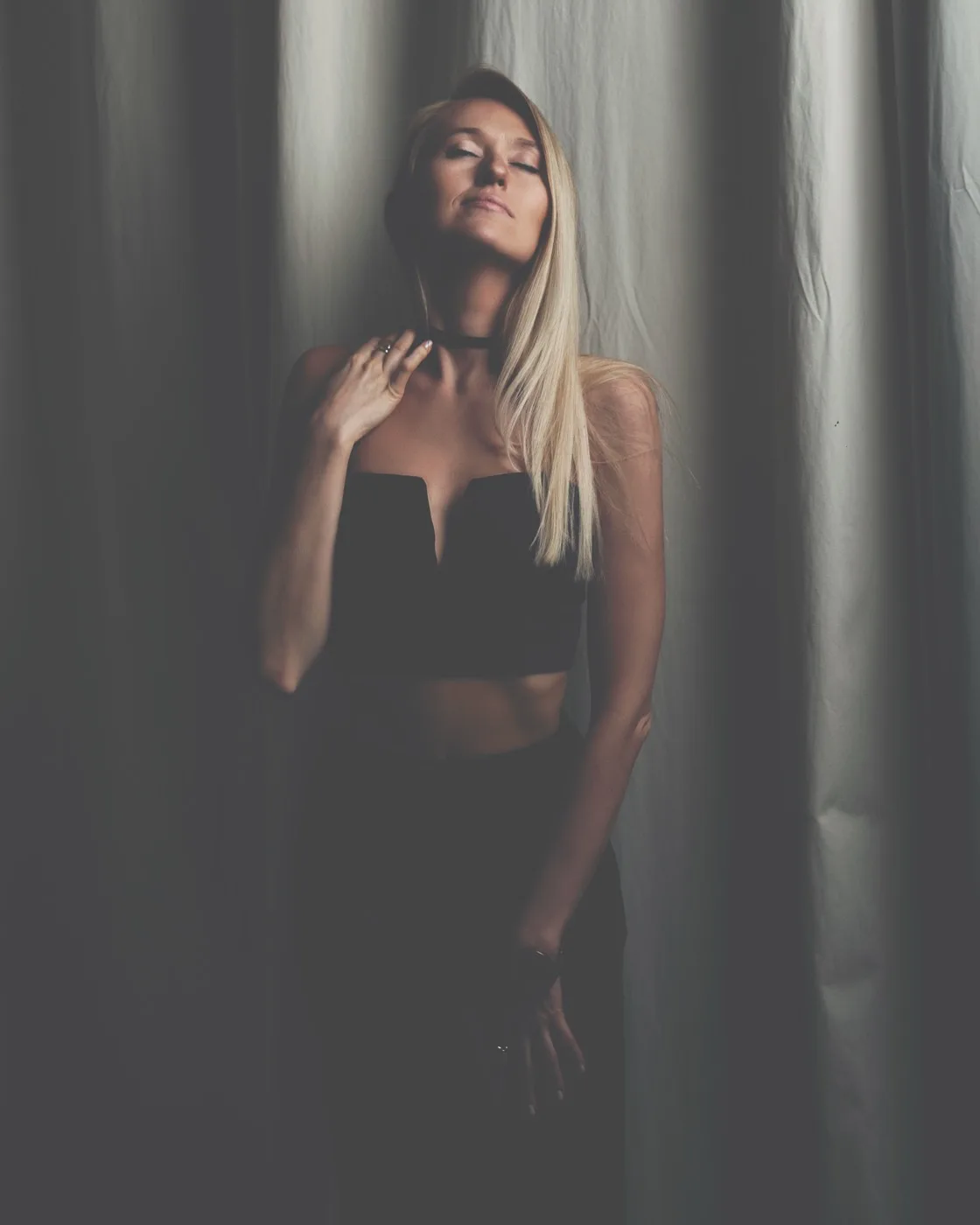 Olga in a moody, low-light home portrait session, shot by Photoczaro