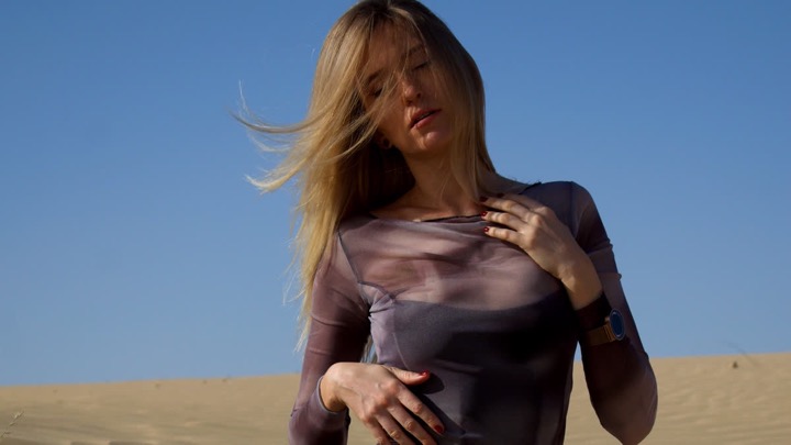 Olga in a flowing dress during a desert editorial shoot, shot by Photoczaro