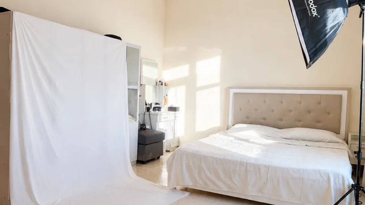 Empty professional photography studio setup with softbox lighting and backdrop