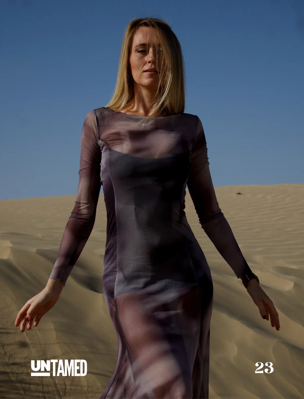 Model Olga walking toward camera in the desert, UNTAMED Magazine editorial by Photoczaro